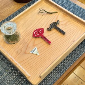 A photo of the Mrs. Crutch brand rolling tray with both signature Mrs. Crutch products shown.