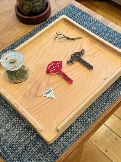 A photo of the Mrs. Crutch brand rolling tray with both signature Mrs. Crutch products shown.